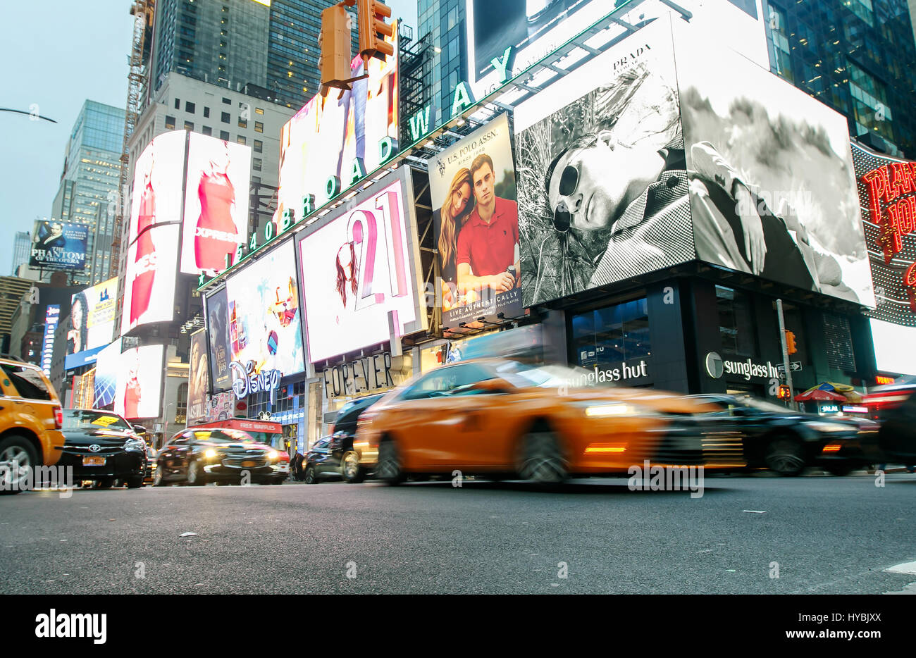 Cars are moving along Broadway at Times Square. Stock Photo