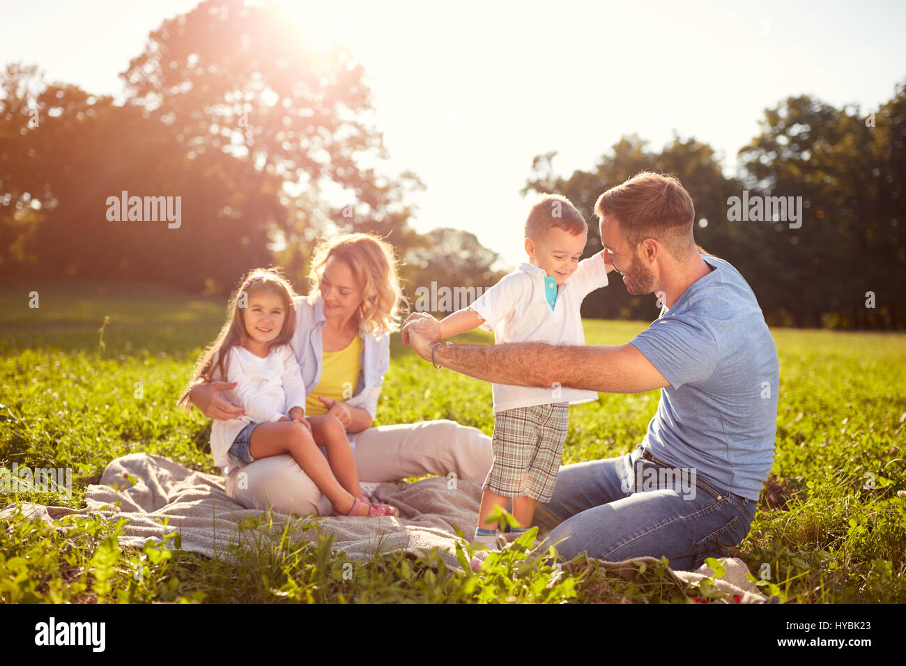 Cute happy family on picnic hi-res stock photography and images - Alamy