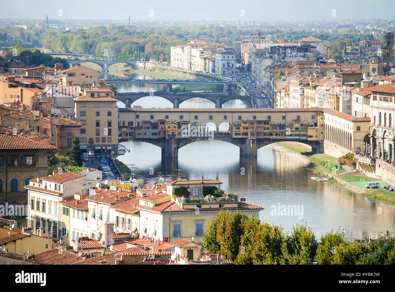 Looking down onto the bridge across the River Arno in Florence, Italy with the landmark Ponte Vecchio as the foremost. Stock Photo