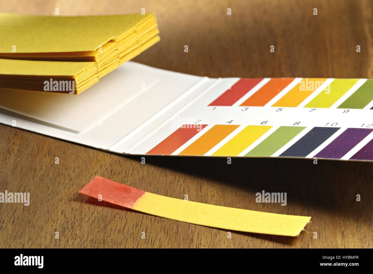 universal indicator paper with acidic testing Stock Photo