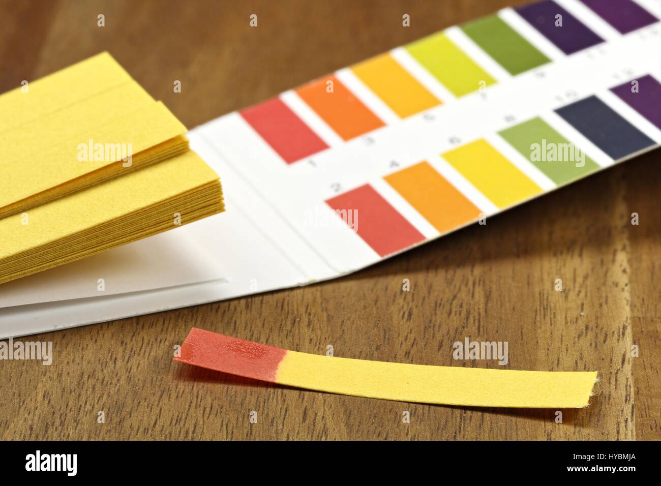 universal indicator paper with acidic testing Stock Photo