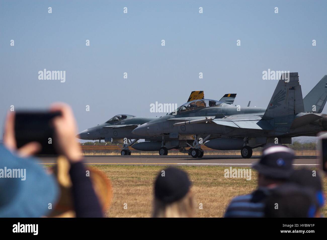 F/A-18F Super Hornet on the runway at Avalon airshow 2017, crowd in front holding up a phone or camera to video the event. Stock Photo