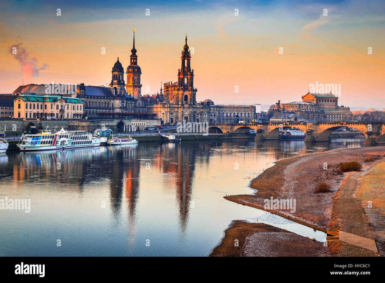 Dresden, Germany. Cathedral of the Holy Trinity or Hofkirche, Bruehl's Terrace. Twilight sunset on Elbe river in Saxony. Stock Photo