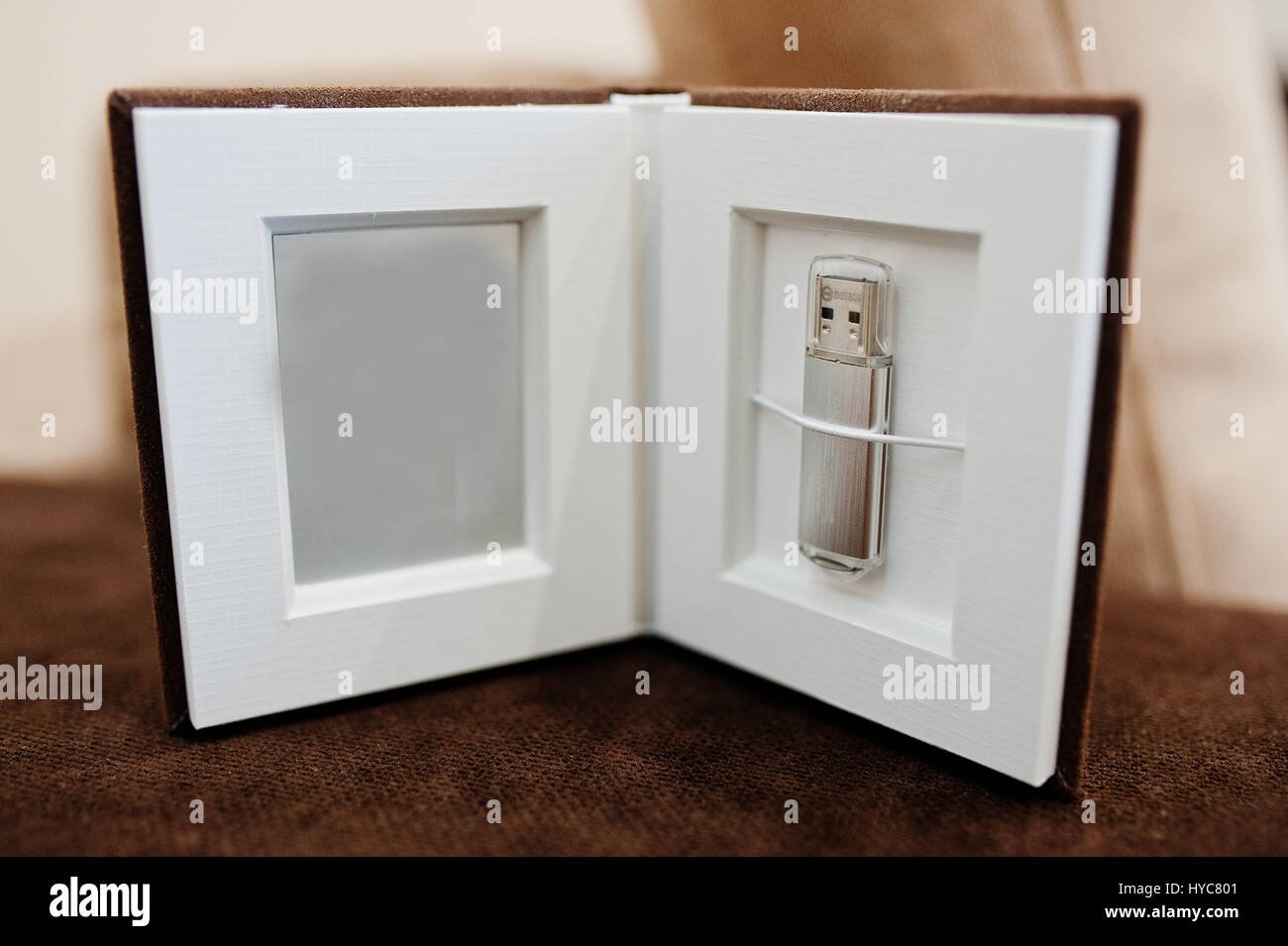 Brown textile flash box with flash drive inside Stock Photo - Alamy