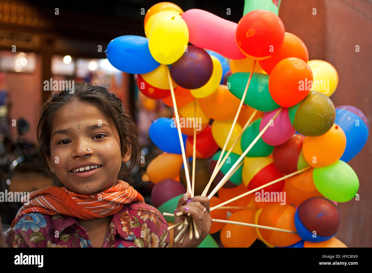 Girl selling balloons hires stock photography and images Alamy