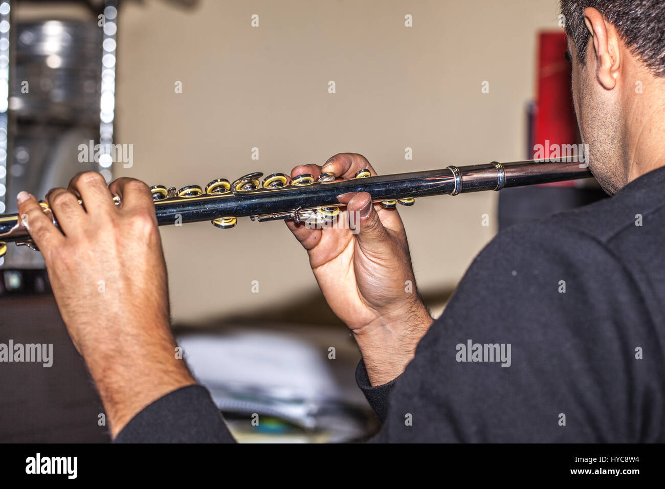 young man playing the flute instrument Stock Photo Alamy