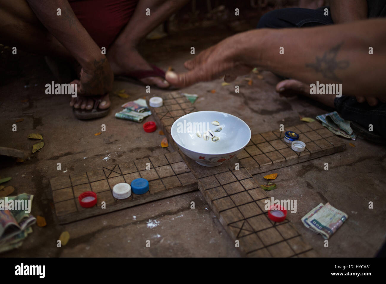 man playing mahjong on the street, mandalay, myanmar, burma Stock Photo