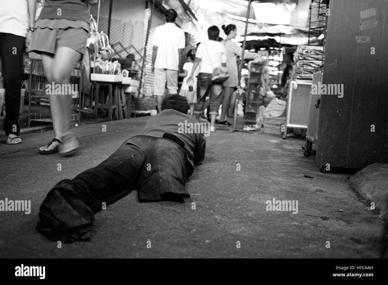 lame man at market place, bangkok, thailand Stock Photo