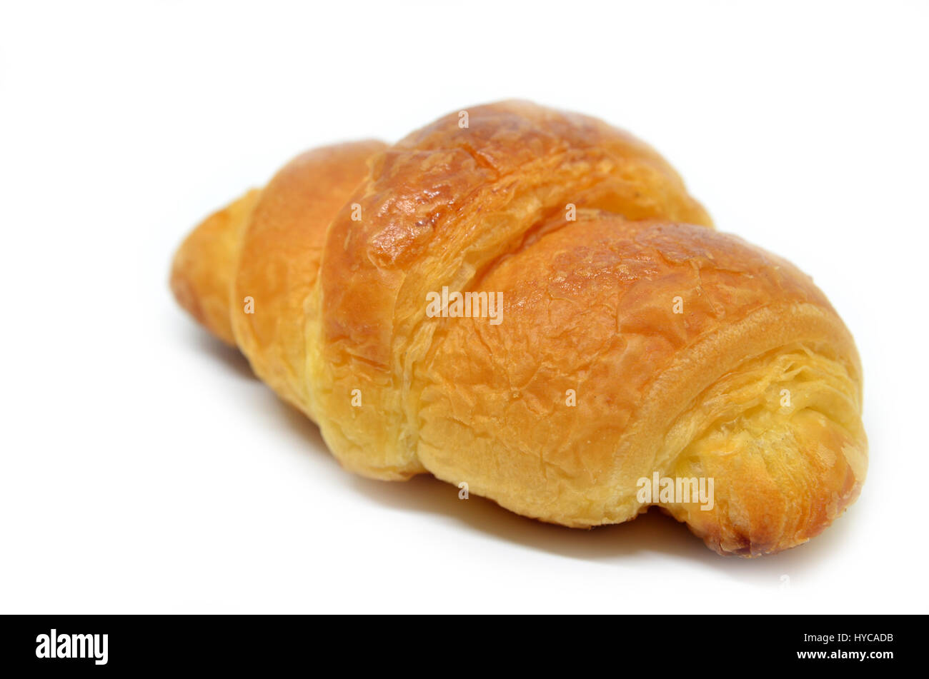 Fresh baked croissant isolated on white background Stock Photo - Alamy