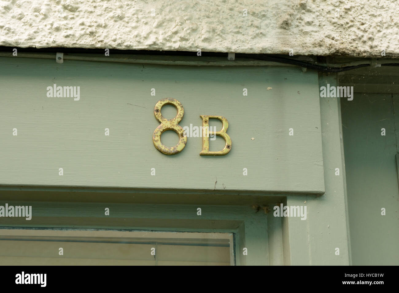 House number 8A sign  on wall Stock Photo