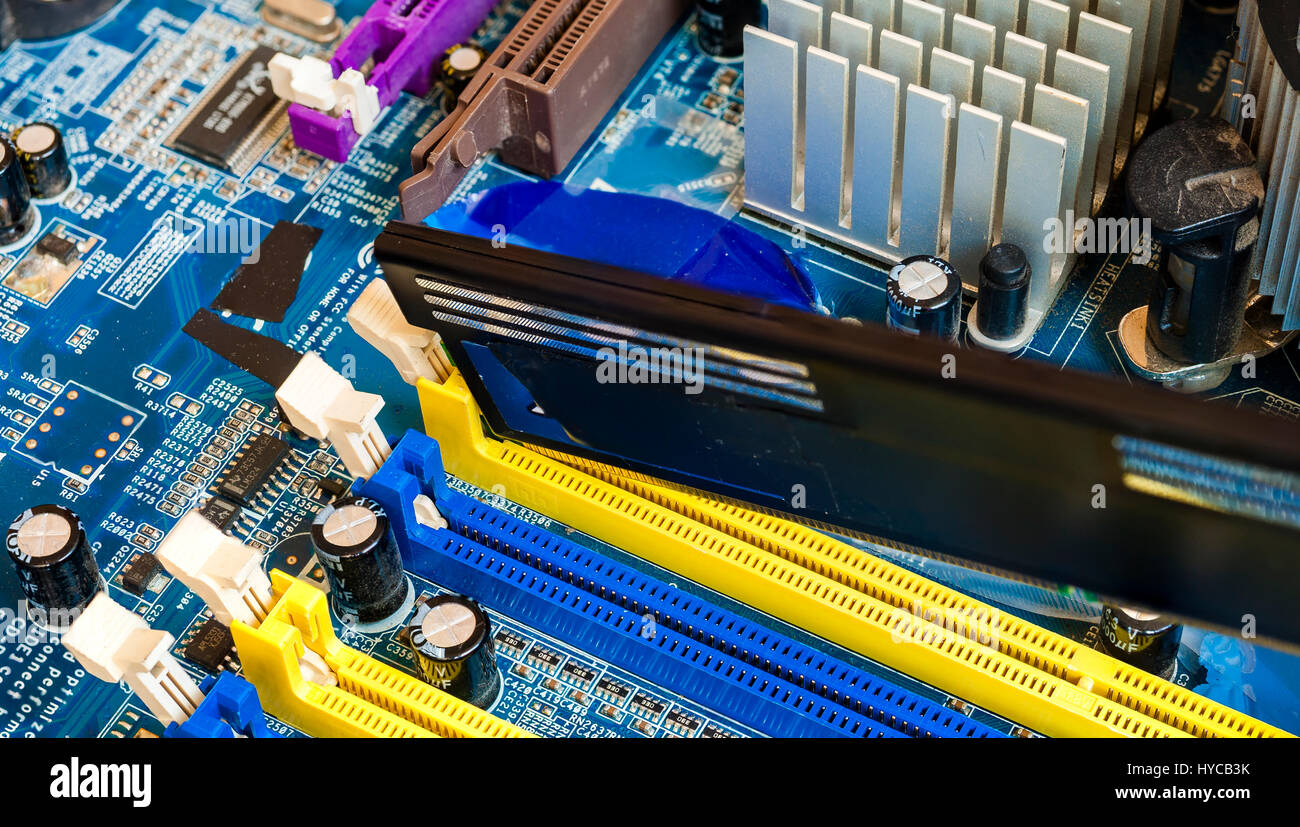 Close up computer memory DDR RAM in the slot of motherboard Stock Photo