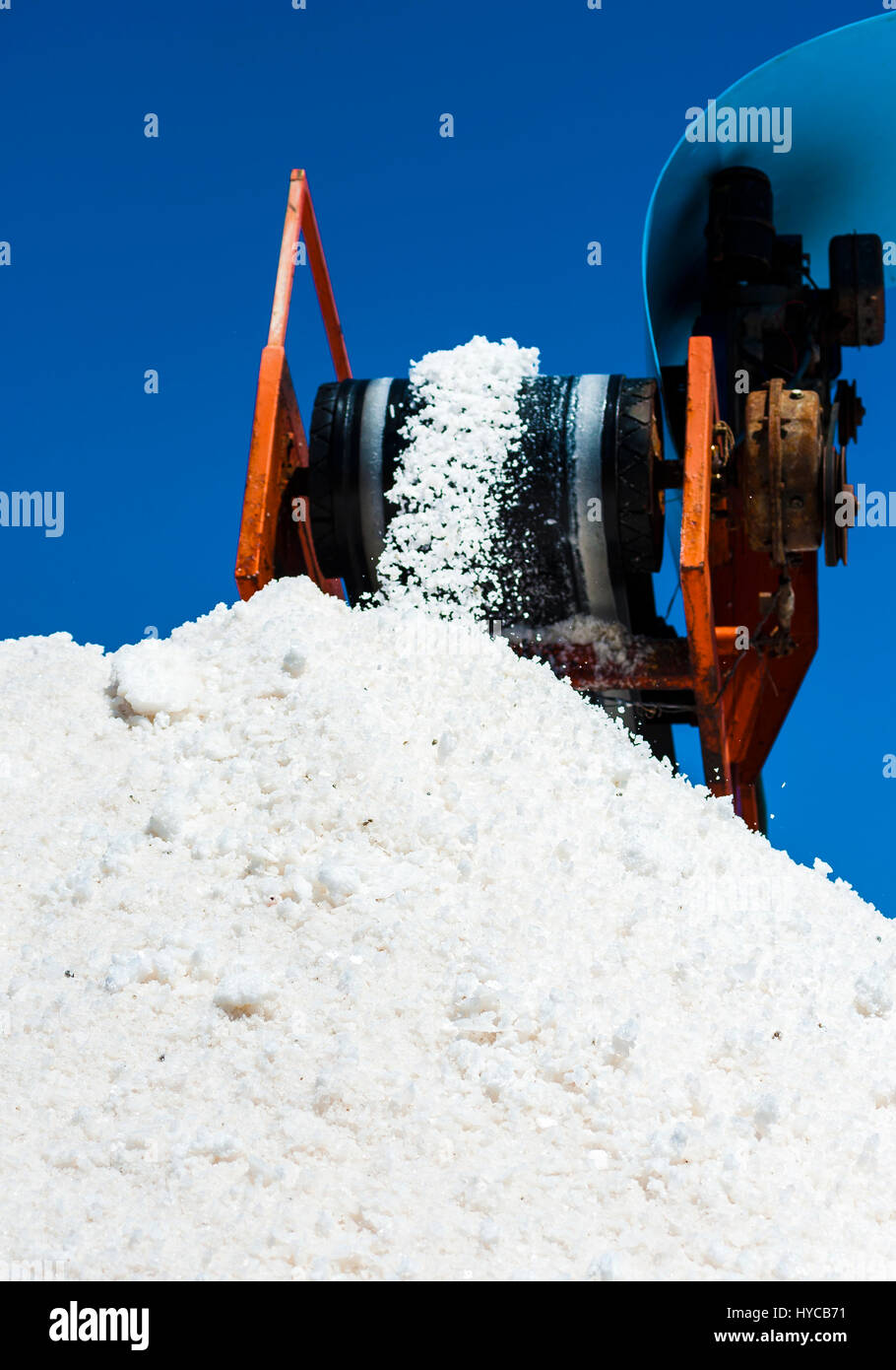conveyor belt with salt harvested in the saline of Trapani, Sicily. ITALY Stock Photo