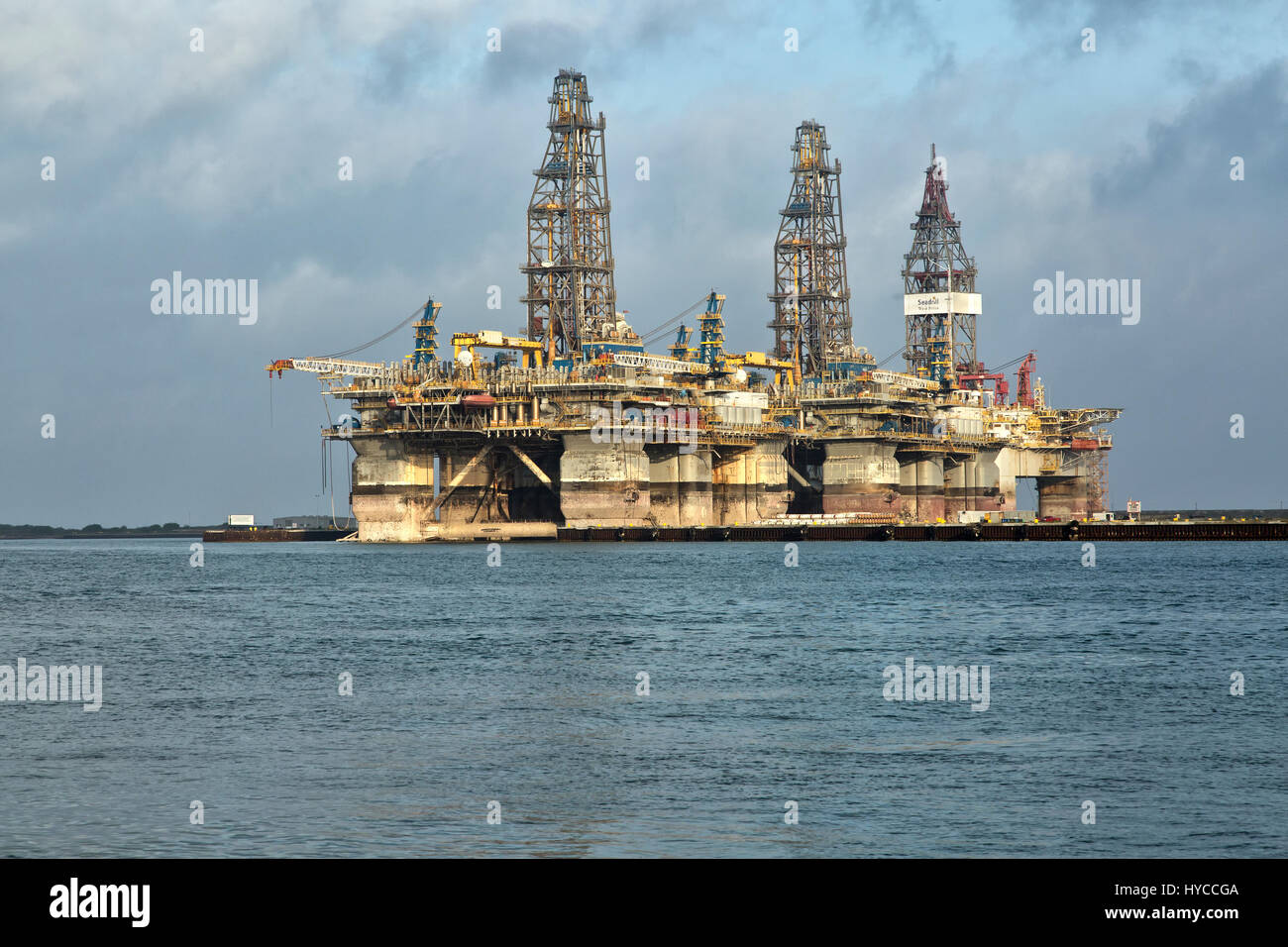 Deep water drill rigs temporarily in storage,  pm light, Harbor Island,  Canyon Port, Port Aransas. Stock Photo