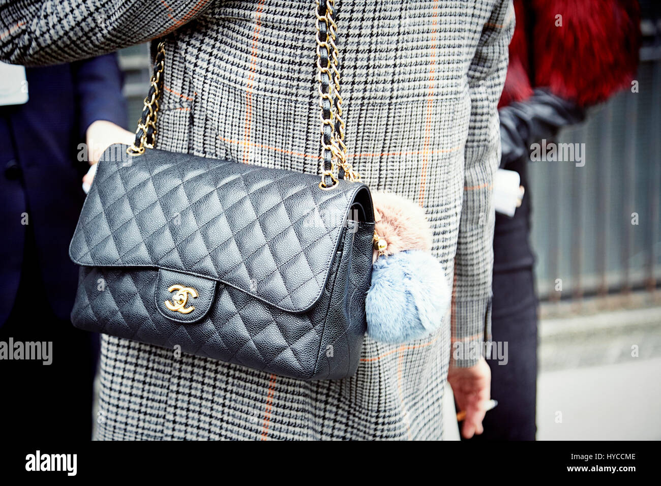 Armani fashion show, Milano fashion week: Chanel bag pochette for fashion  people standing outside the show, via Bergognone Armani Silos Stock Photo -  Alamy