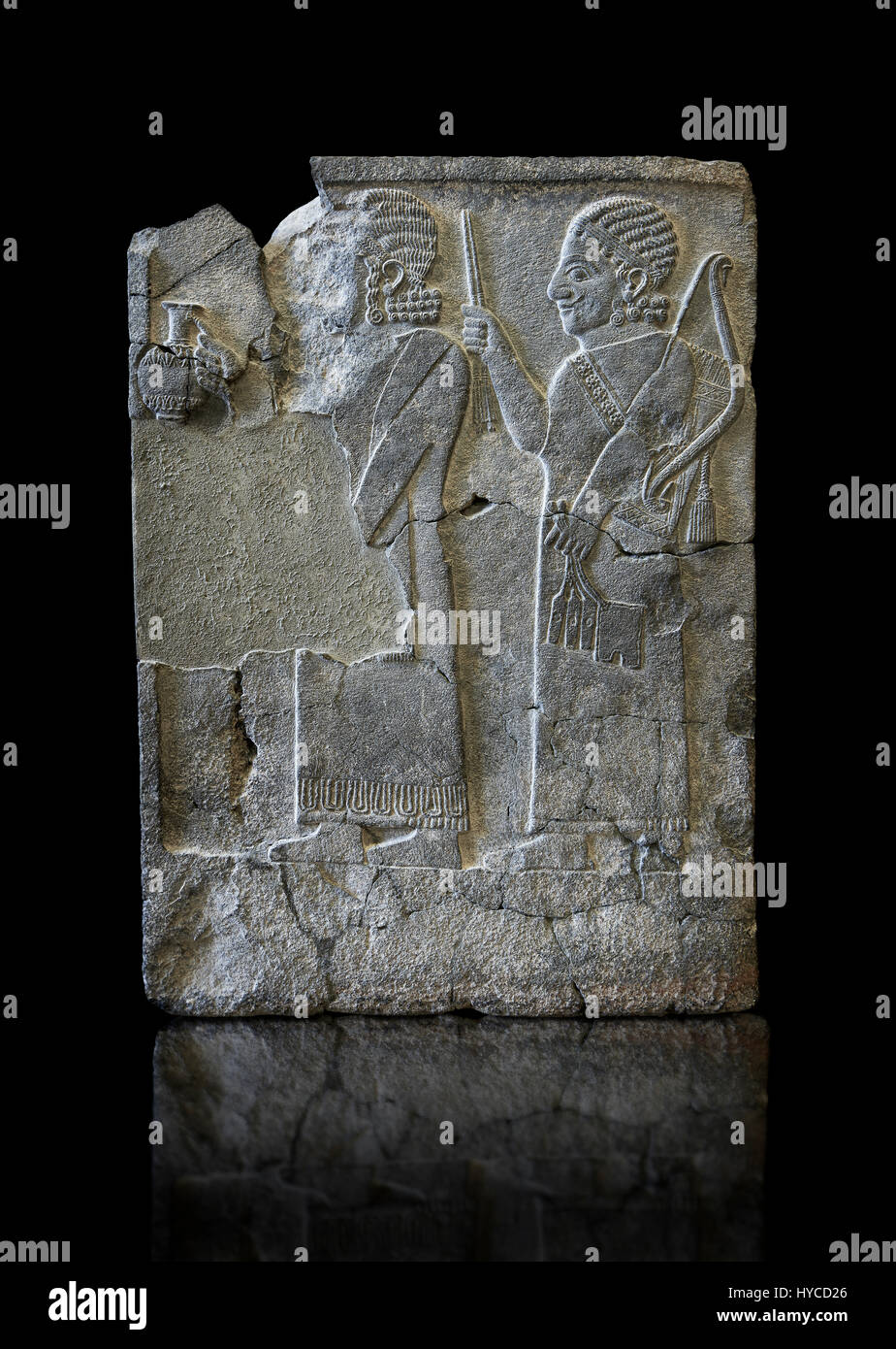 Relief panels Orthostats with representation from court officials de front a vessel, the second supporting arms. Found in North Hall of Sam'al - Zinci Stock Photo