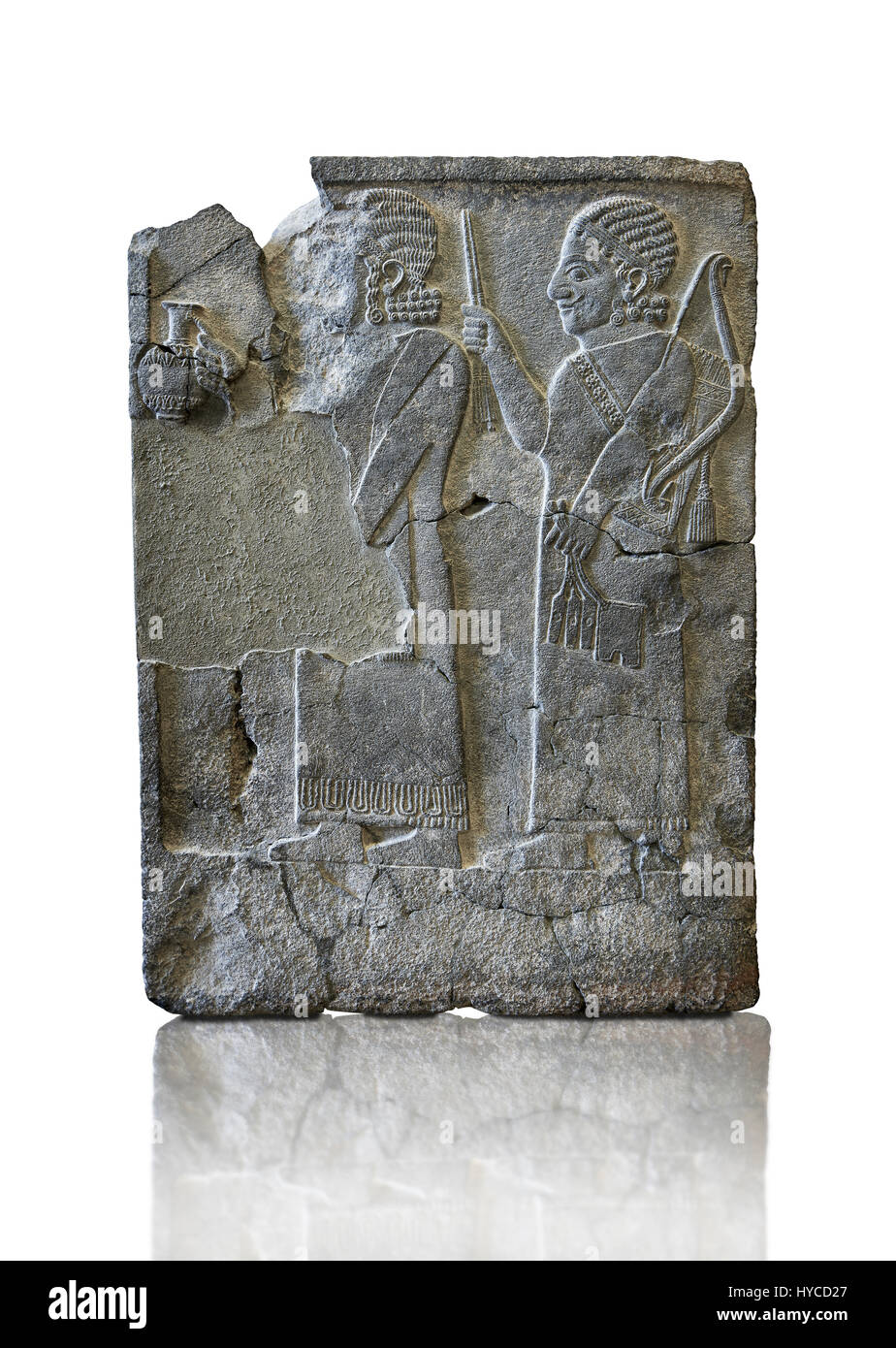 Relief panels Orthostats with representation from court officials de front a vessel, the second supporting arms. Found in North Hall of Sam'al - Zinci Stock Photo