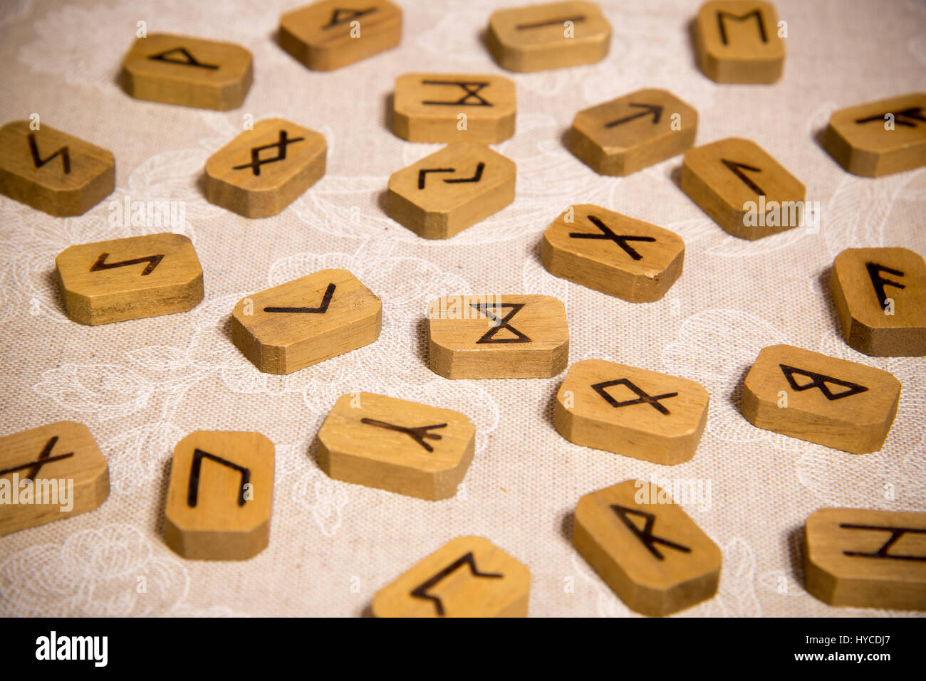 Wooden runes on the table. Esoteric subjects. Stock Photo