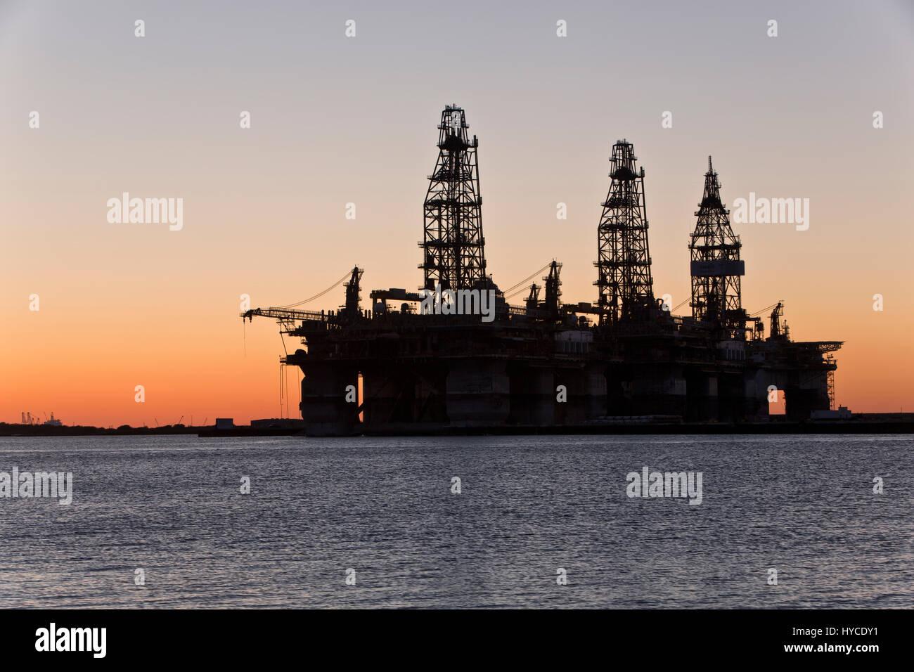 Deep water drill rigs temporarily in storage,  sunset, Harbor Island,  Canyon Port, Port Arius petroleum Aransas. Stock Photo