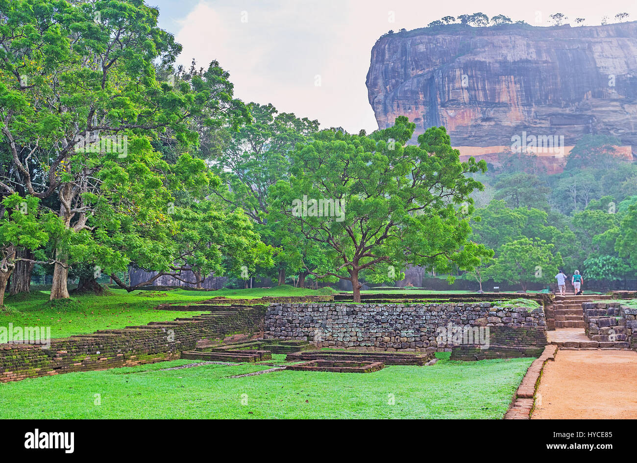 The footpath leads to Sigiriya Rock, the preserved ancient natural formation, that was used for building of citadel and preserves its ruins to nowaday Stock Photo