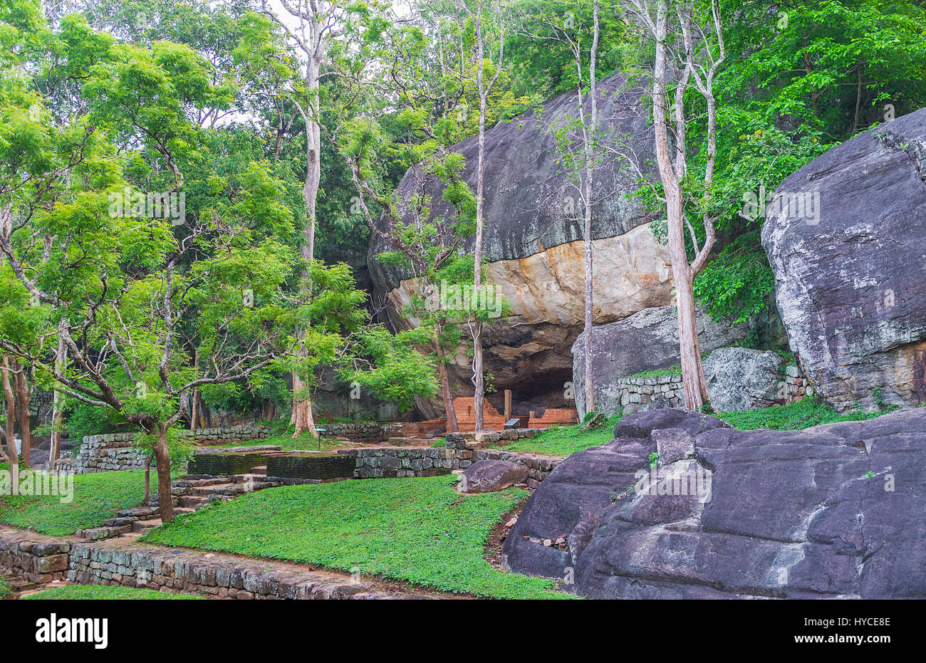 The numerous caves in Sigiriya rocks were used by Buddhist monks as shelters or temples, Sri Lanka. Stock Photo