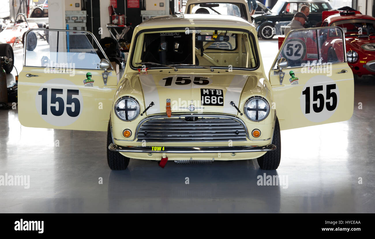 Ray Low's Classic Morris Cooper S racing Mini in the International Pit garage's  during the Silverstone Classic Media Day Stock Photo
