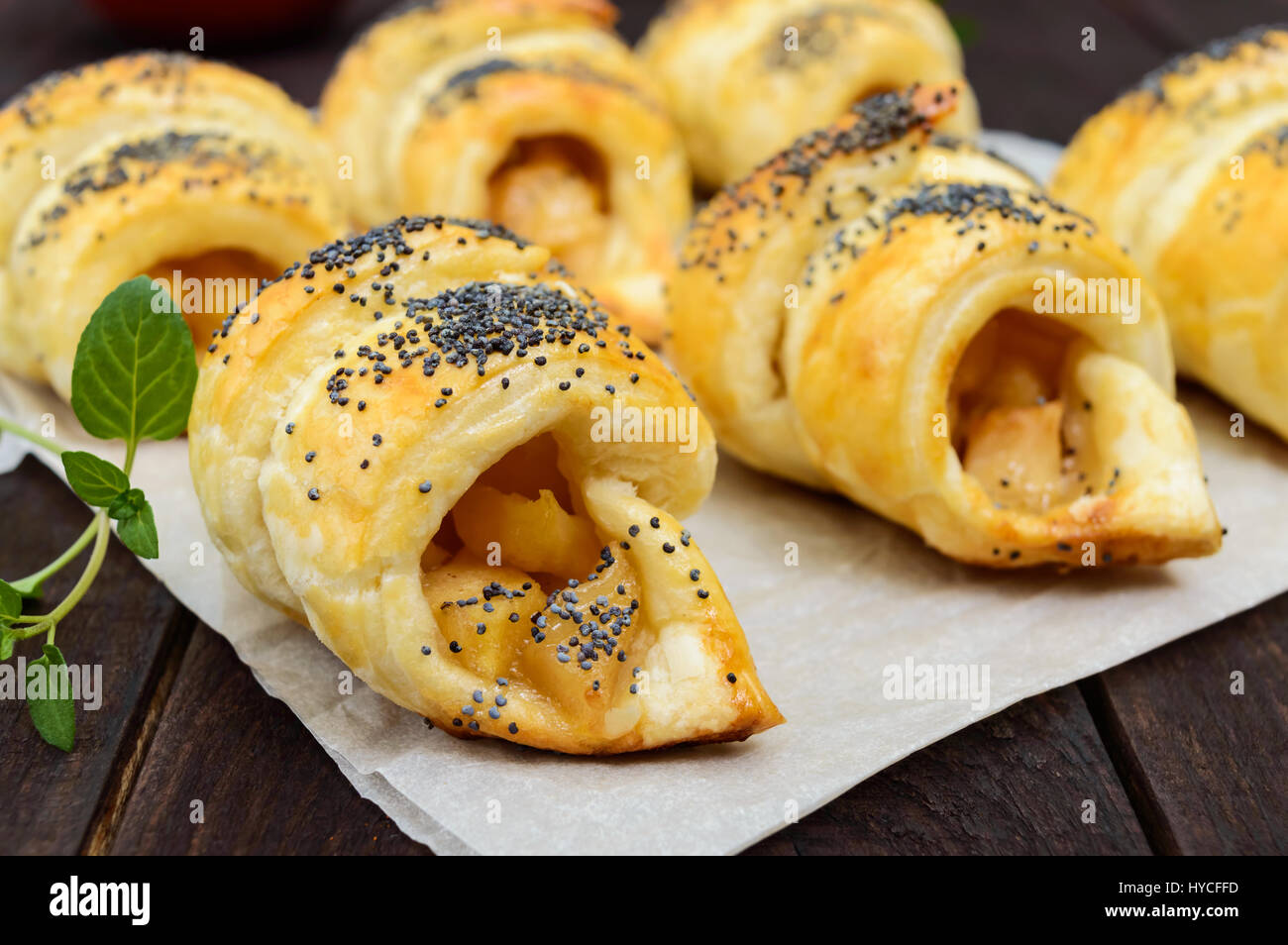 Home made croissants (bagels) with apples, decorated with poppy seeds ...