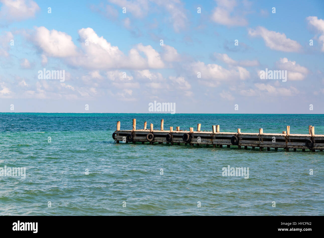 View of a pier extending out into the Caribbean Sea in Punta Allen in the Sian Kaan Biosphere Reserve near Tulum, Mexico Stock Photo