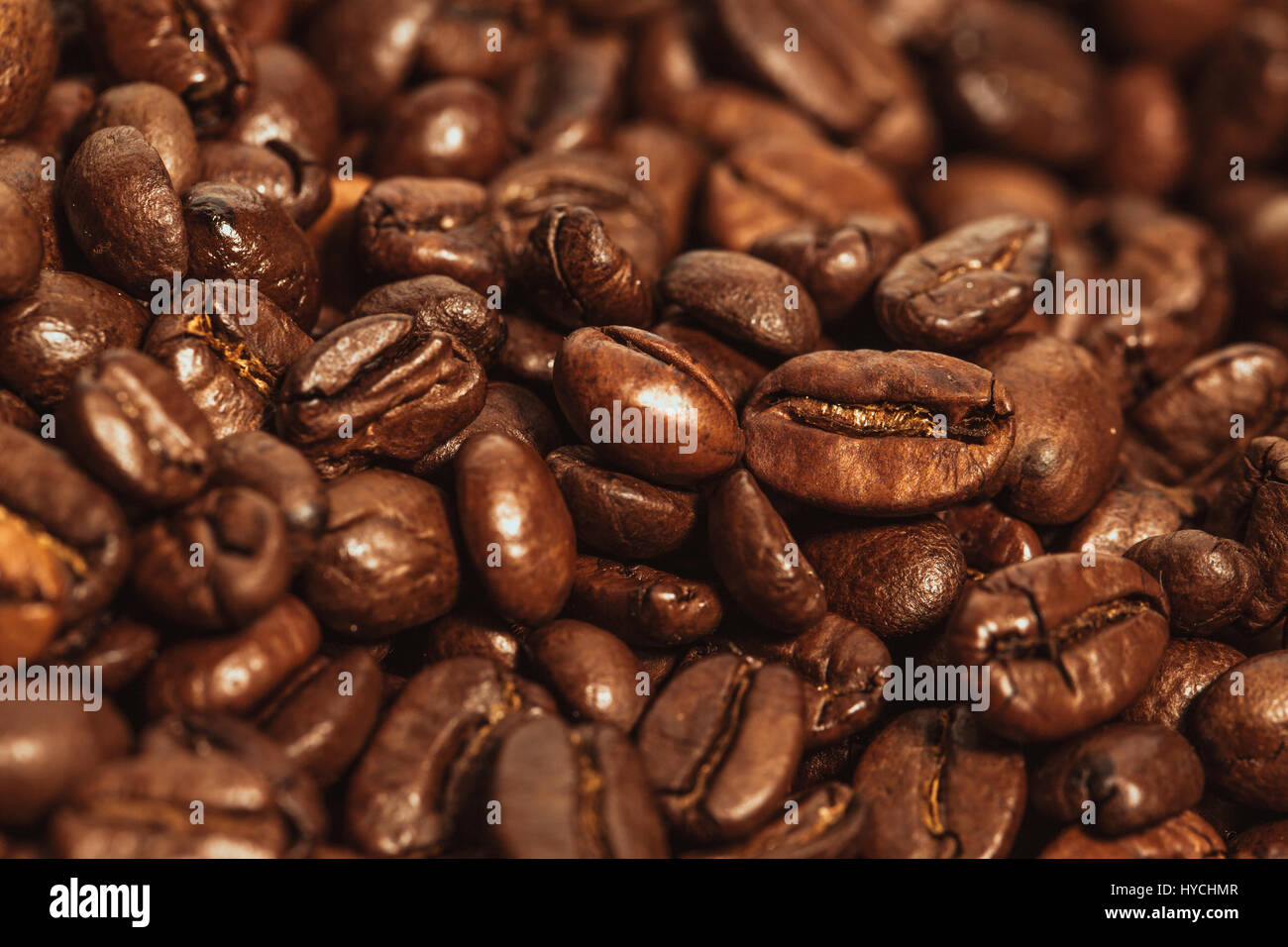 Dark many roasted coffee beans texture background Stock Photo - Alamy