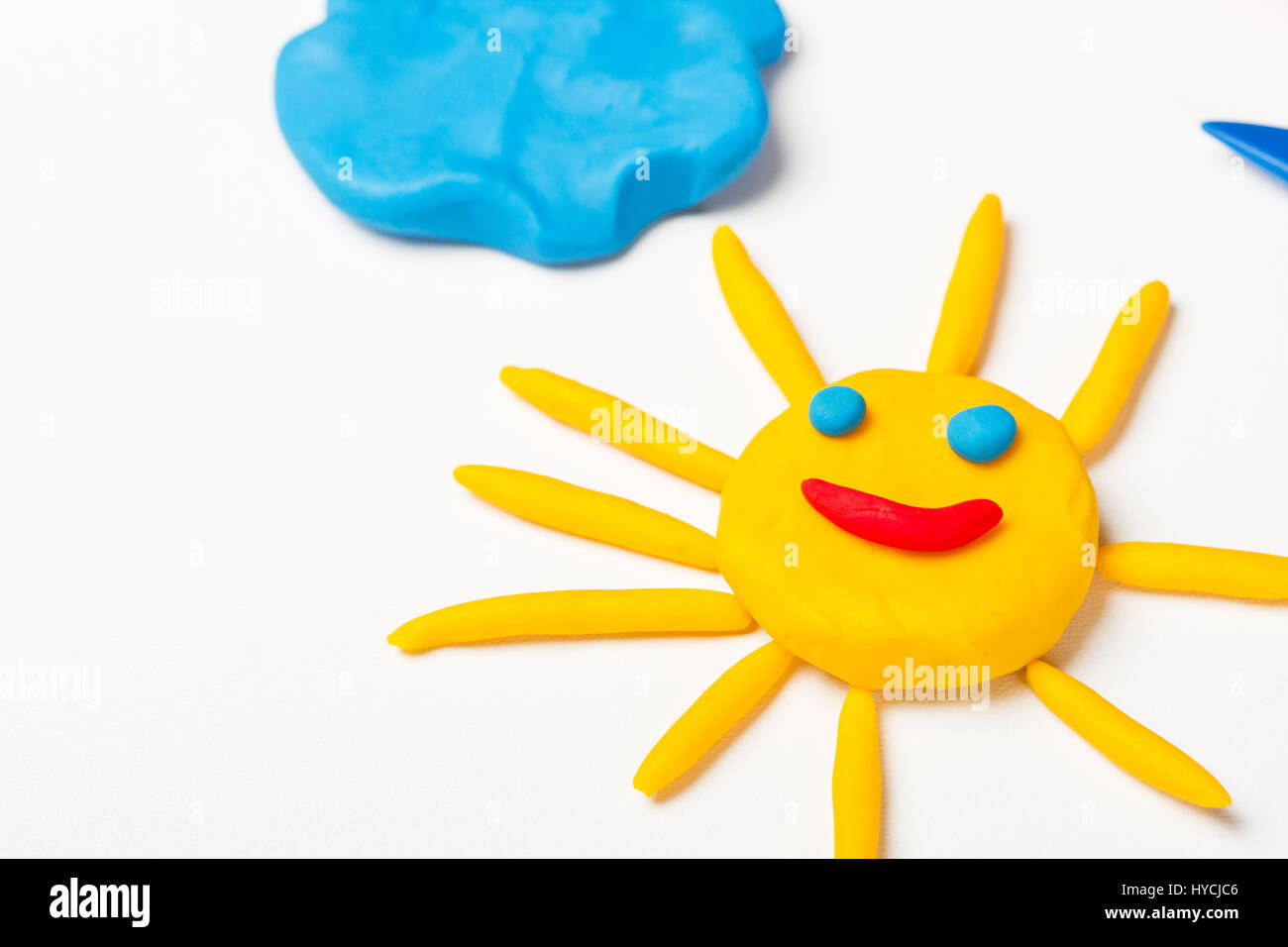 Plasticine sun with emoticons Stock Photo