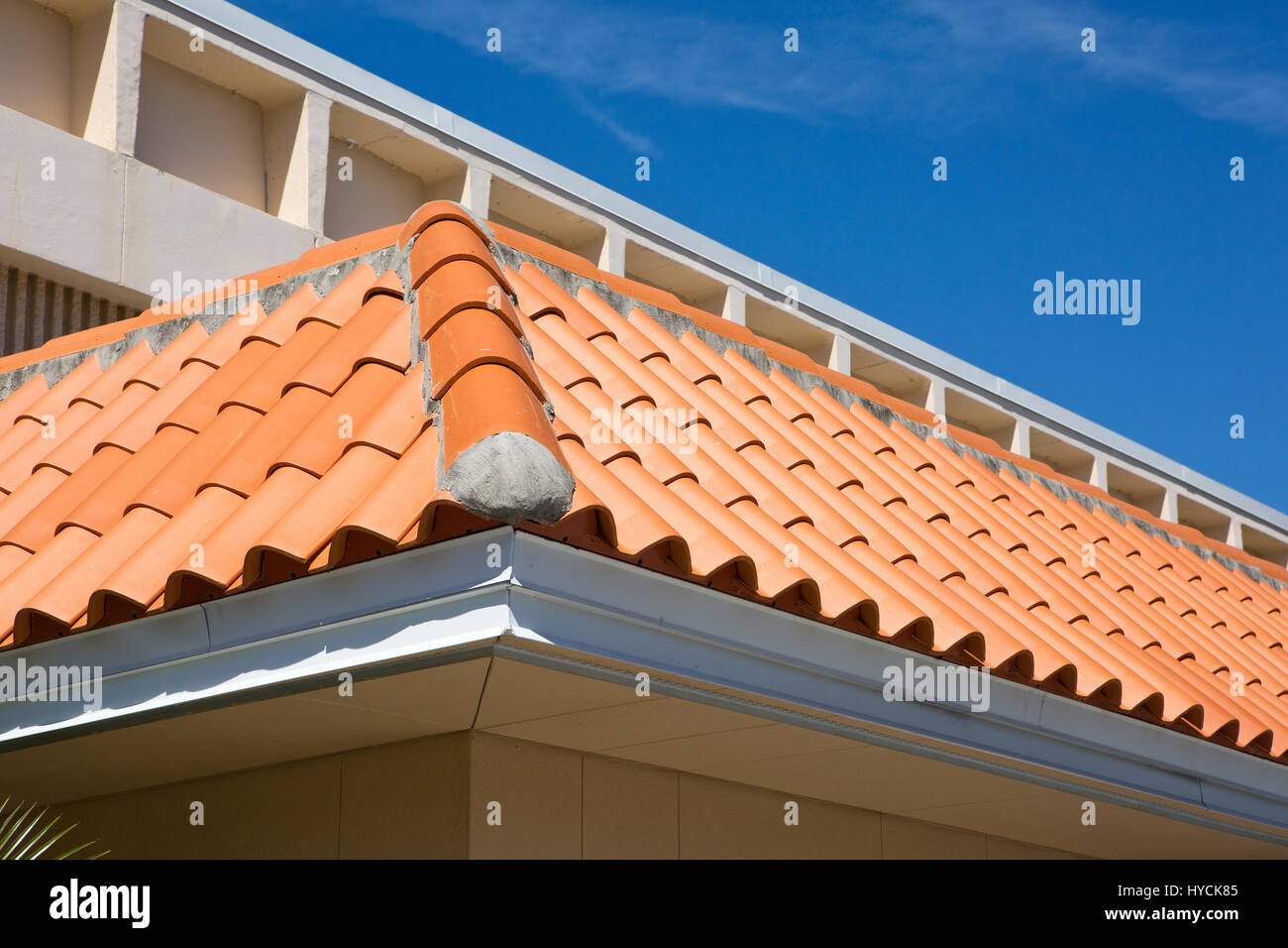 Detail of an overlapped barrel tile roof with cement mortared joints. Stock Photo