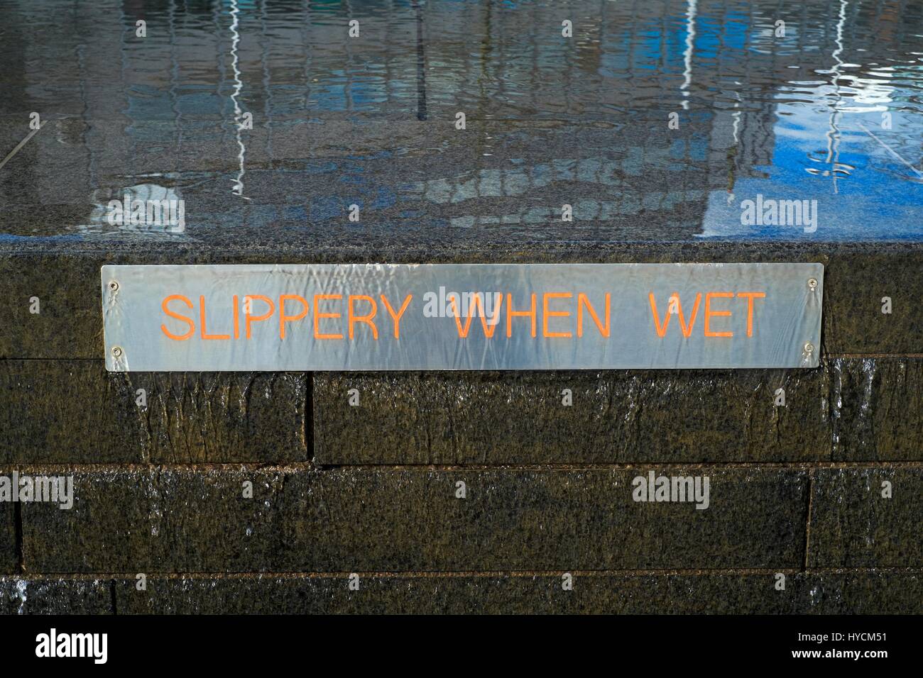 Slippery when wet sign Stock Photo - Alamy