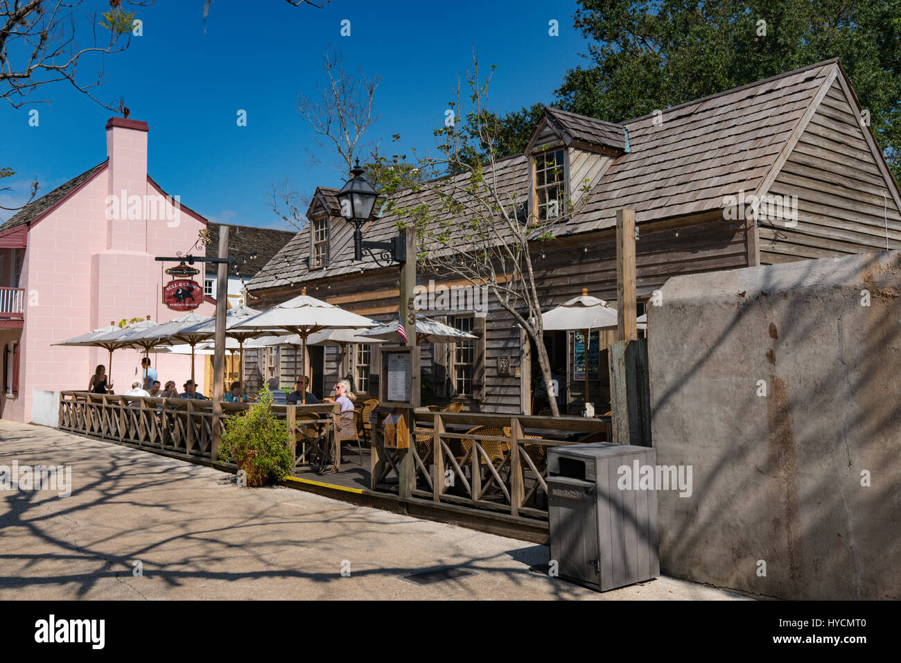 Tourists enjoy adrink at the Bull and Crown pub on St Street in