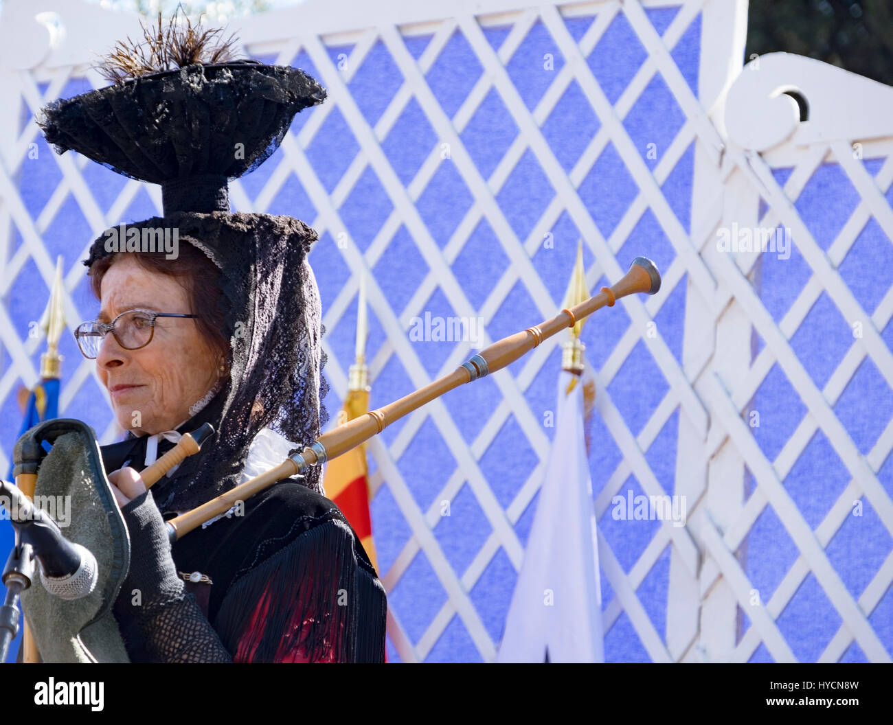 Female bagpipe player prepares to accompany traditional folk dancers in Nice, France for a public performance Stock Photo
