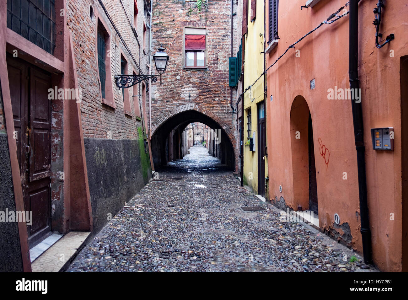 Archways and street scene of the medieval city of Ferrara, Italy Stock Photo