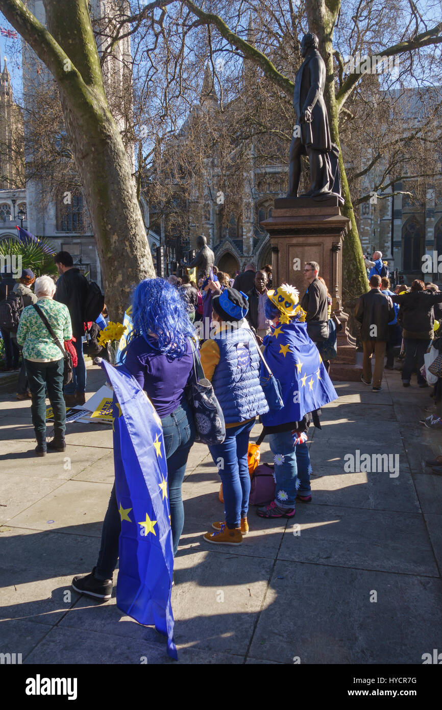 25th March 2017 - 100,000 people march in London against Brexit on the EU 60th anniversary. Listening to speeches in Parliament Square Stock Photo