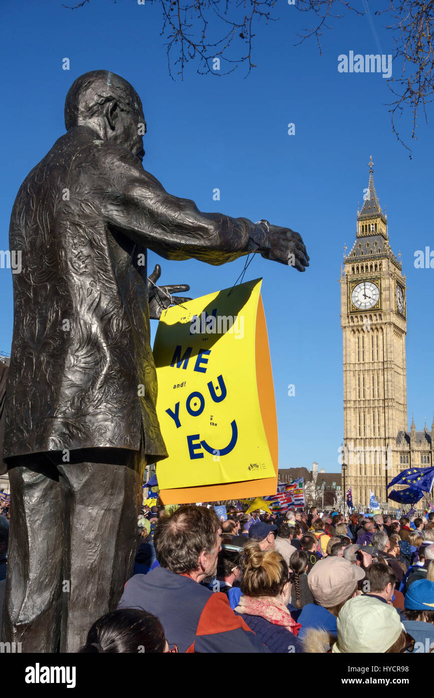 25th March 2017 - 100,000 people march in London against Brexit on the EU 60th anniversary. Crowd in Parliament Square with the Nelson Mandela statue Stock Photo