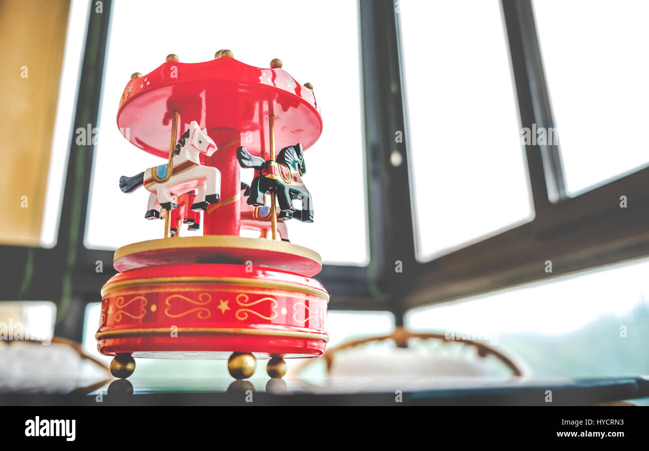 retro filtered toy music box red toned merry go round carousel horses Stock Photo Alamy