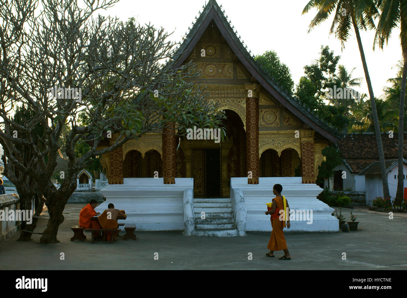 Monks studying at Wat Sen Monastery, Luang Prabang Stock Photo