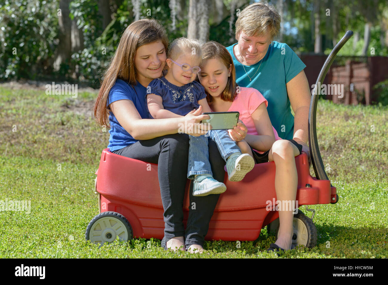 Mother and daughters down syndrome Stock Photo
