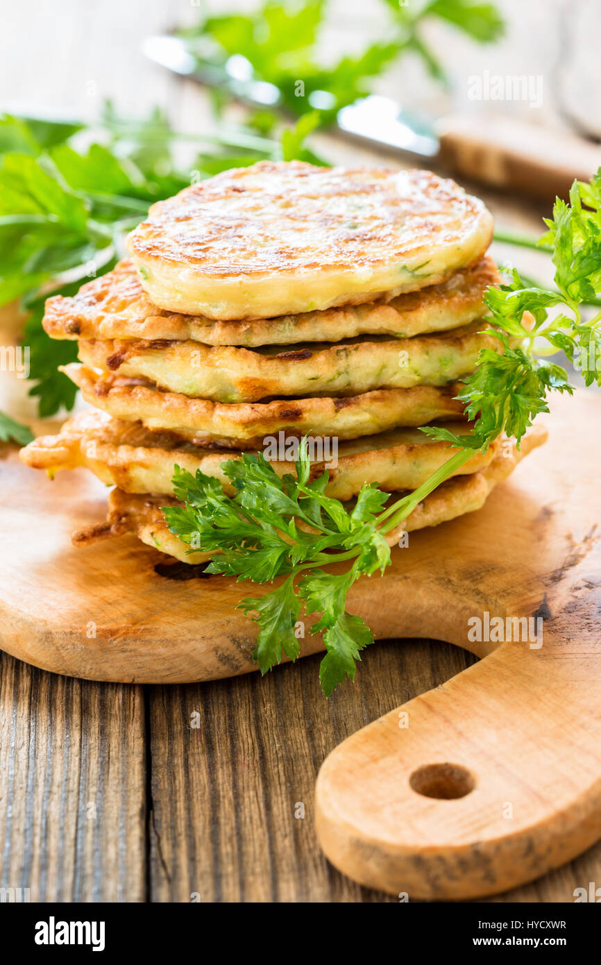 Squash and zucchini fritters on wooden table Stock Photo Alamy