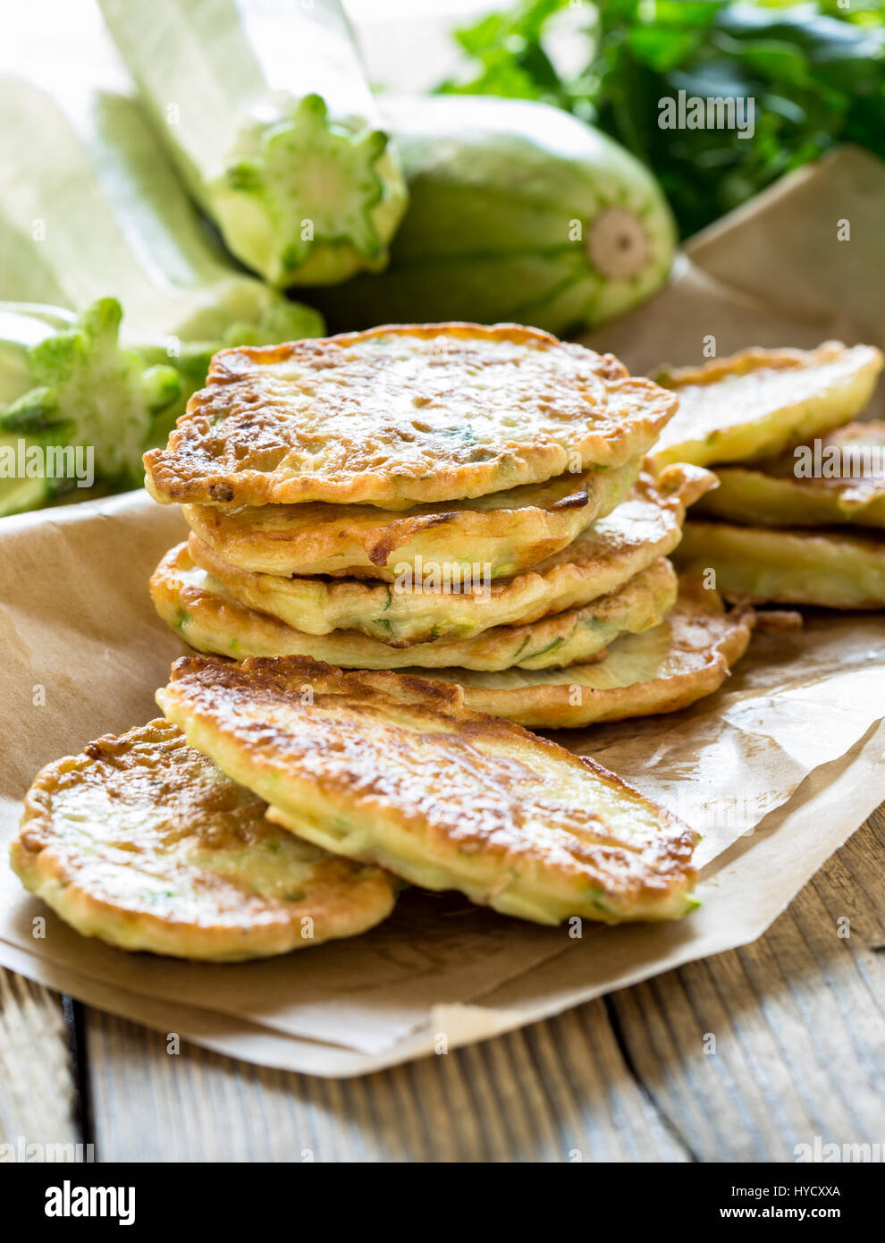 Squash and zucchini fritters on wooden table Stock Photo Alamy