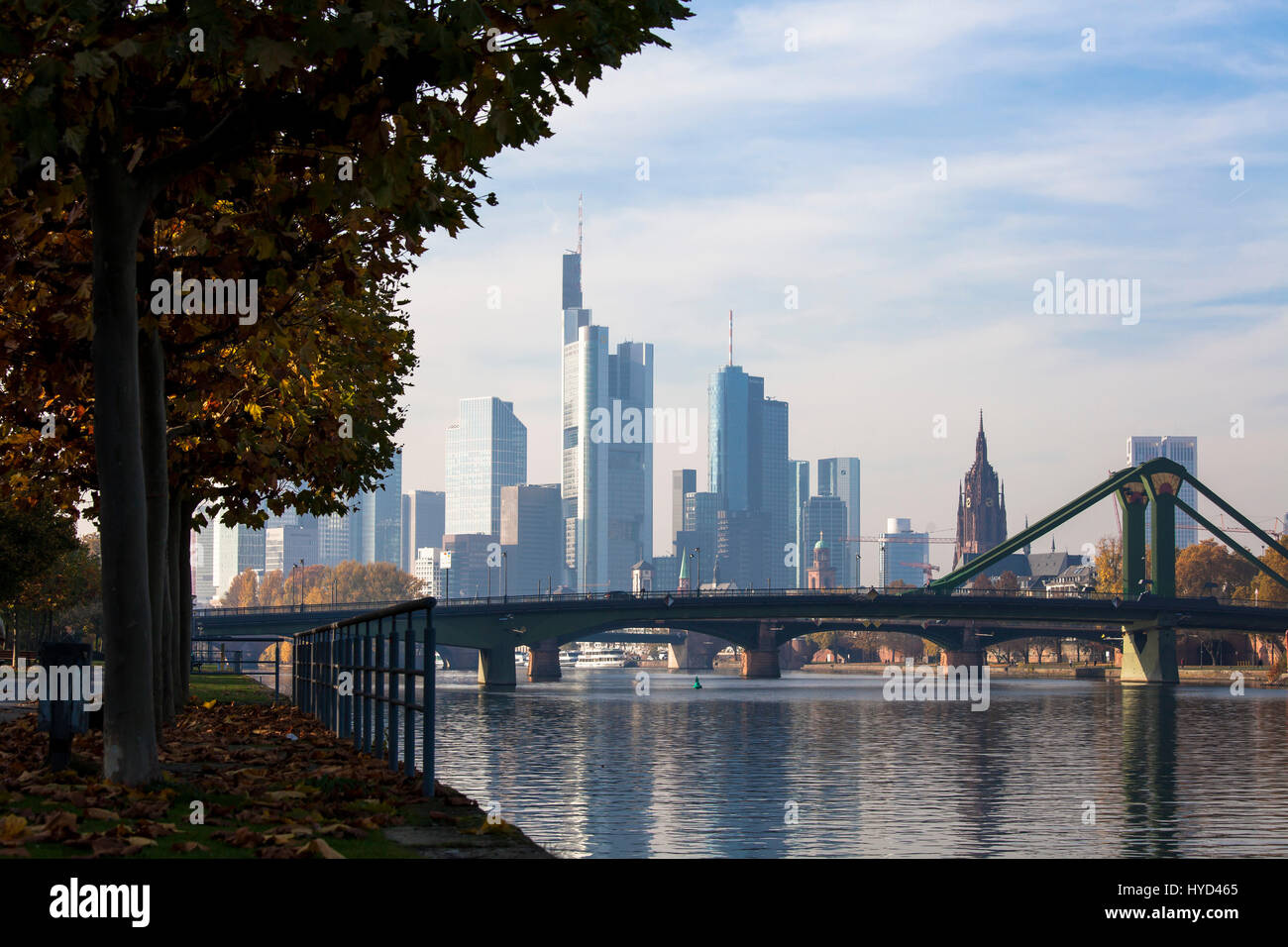 Germany, Hesse, Frankfurt, view across the river Main to the skyscrapers of the financial district the Kaiserdom cathedral, Floesser bridge. Stock Photo