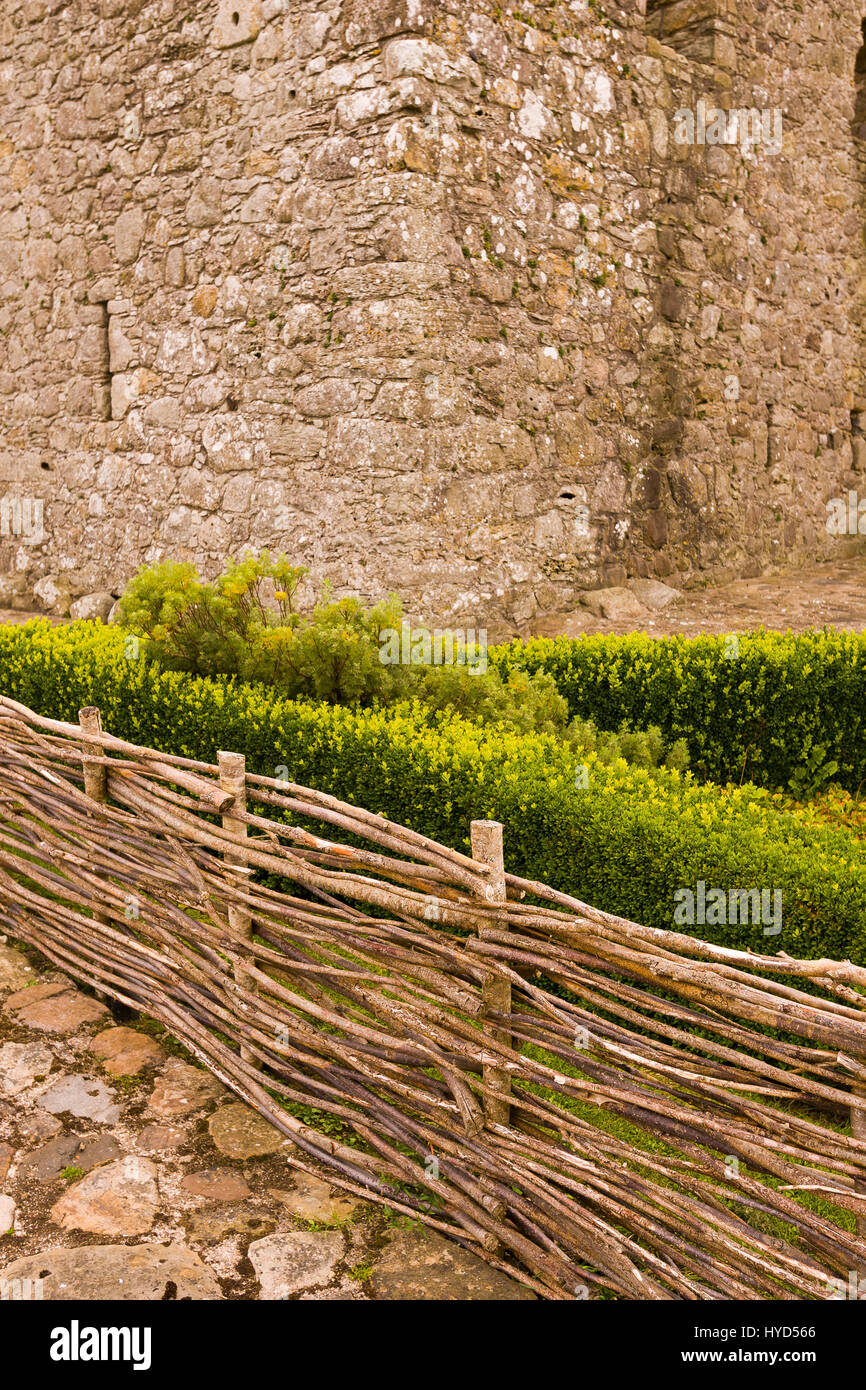 TULLY CASTLE, NORTHERN IRELAND - Wooden fence at ruins of Tully Castle, near Enniskillen, on Lower Lough Erne. Tully Castle, built early 1600s, in County Fermanagh, near the village of Blaney. Stock Photo