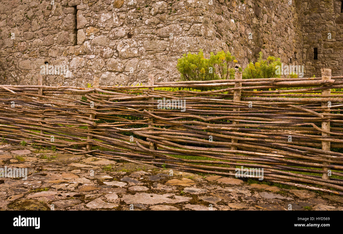TULLY CASTLE, NORTHERN IRELAND - Wooden fence at ruins of Tully Castle, near Enniskillen, on Lower Lough Erne. Tully Castle, built early 1600s, in County Fermanagh, near the village of Blaney. Stock Photo
