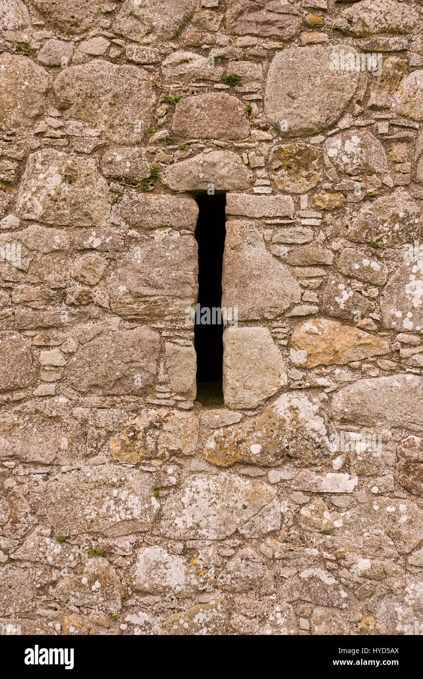 TULLY CASTLE, NORTHERN IRELAND - Arrow loop in wall, ruins of Tully Castle, near Enniskillen, on Lower Lough Erne. Tully Castle,  early 1600s, is in County Fermanagh, near village of Blaney, on southern shore of Lower Lough Erne. Stock Photo
