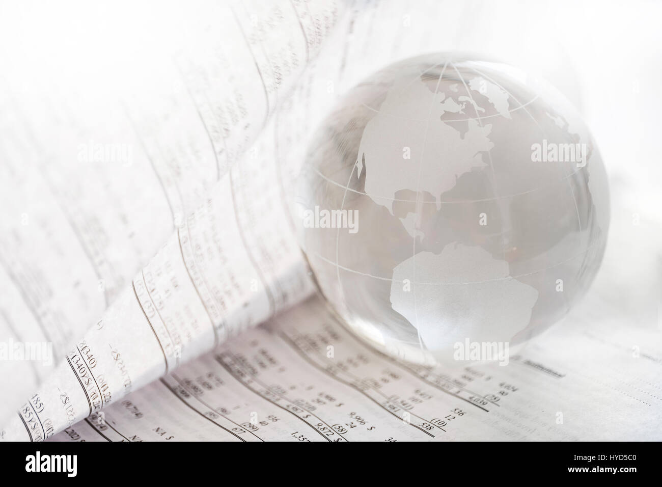 Financial newspaper with crystal ball Stock Photo - Alamy