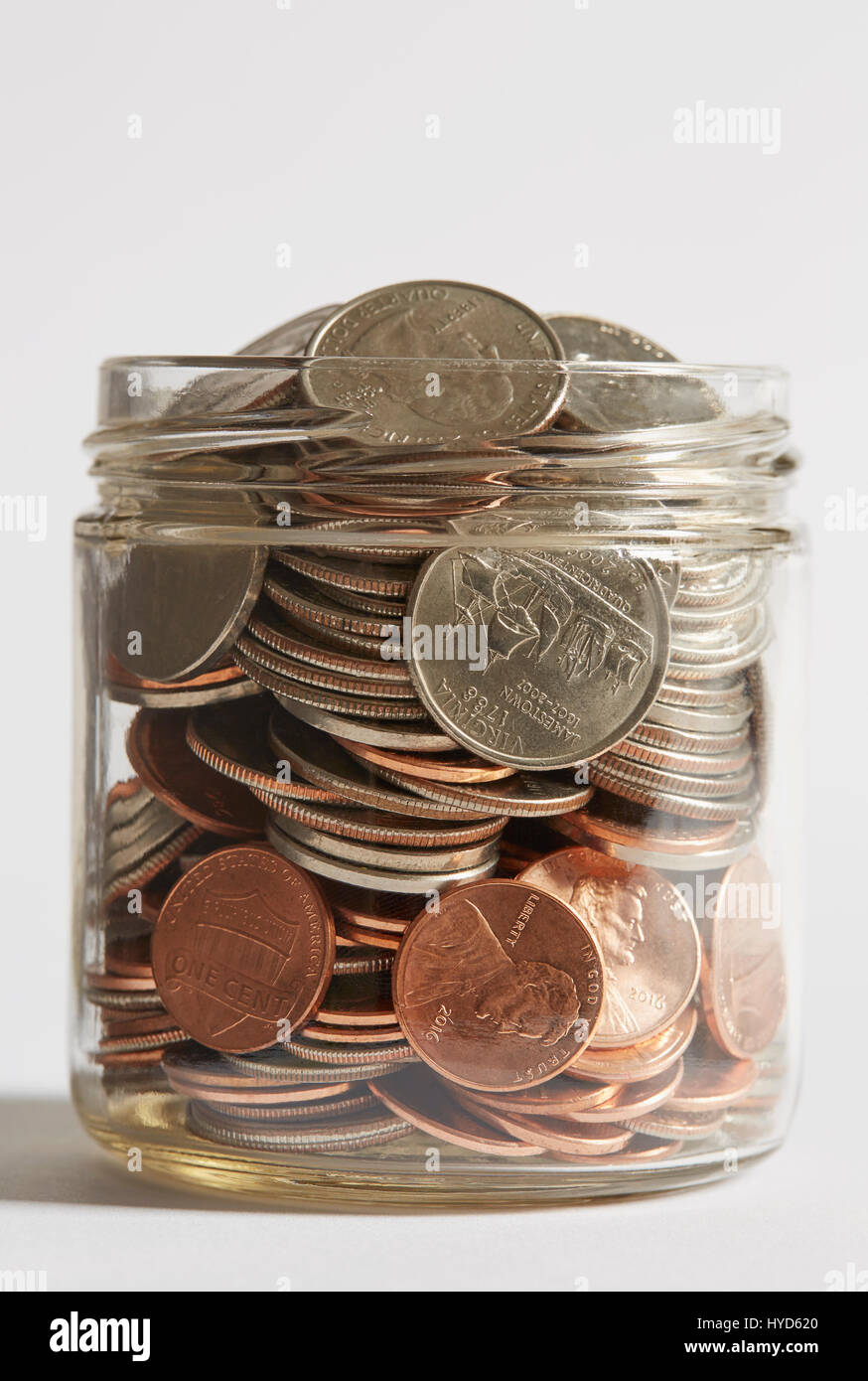 Jar of coins Stock Photo - Alamy