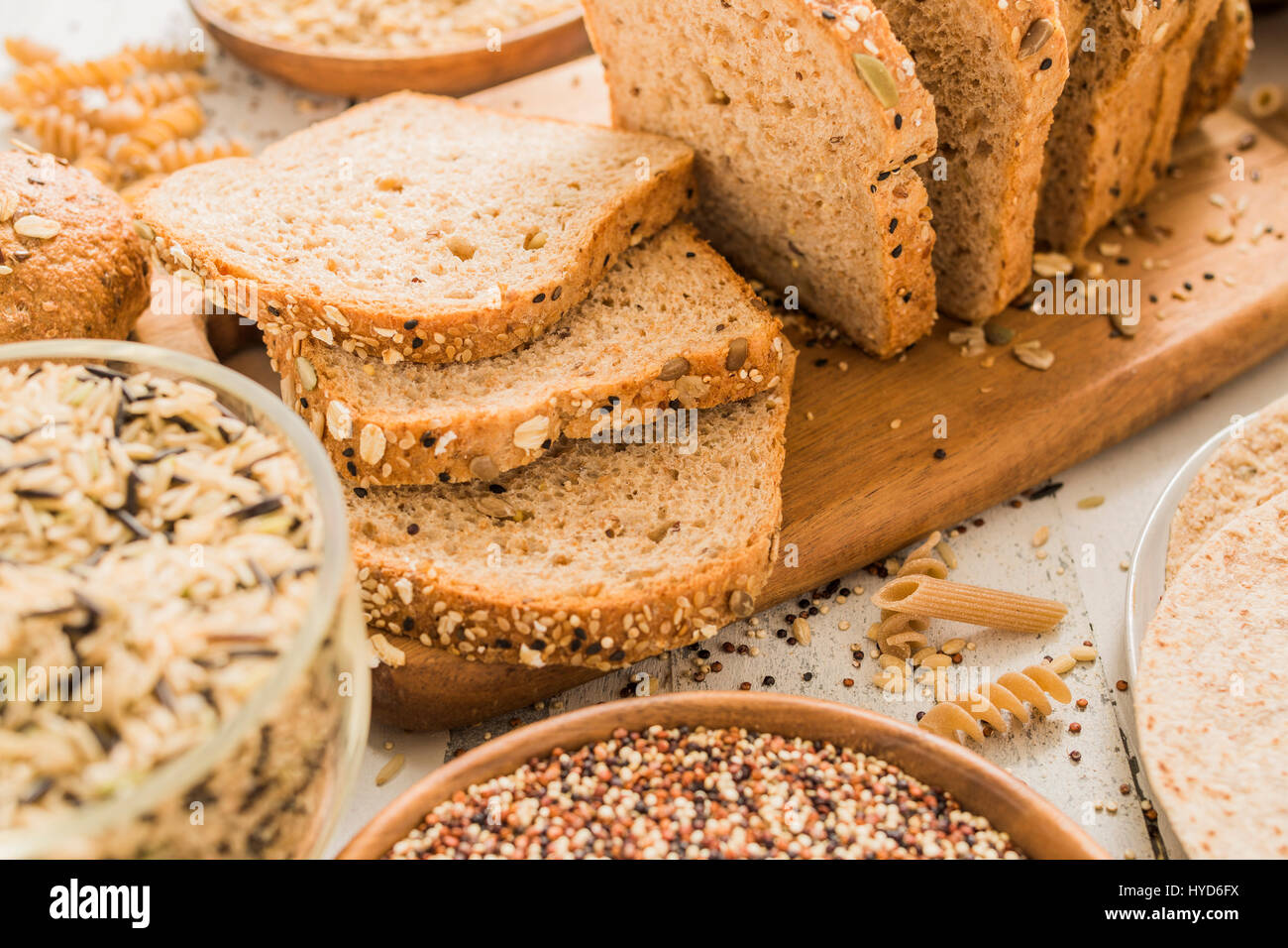 Sliced brown bread on cutting board Stock Photo