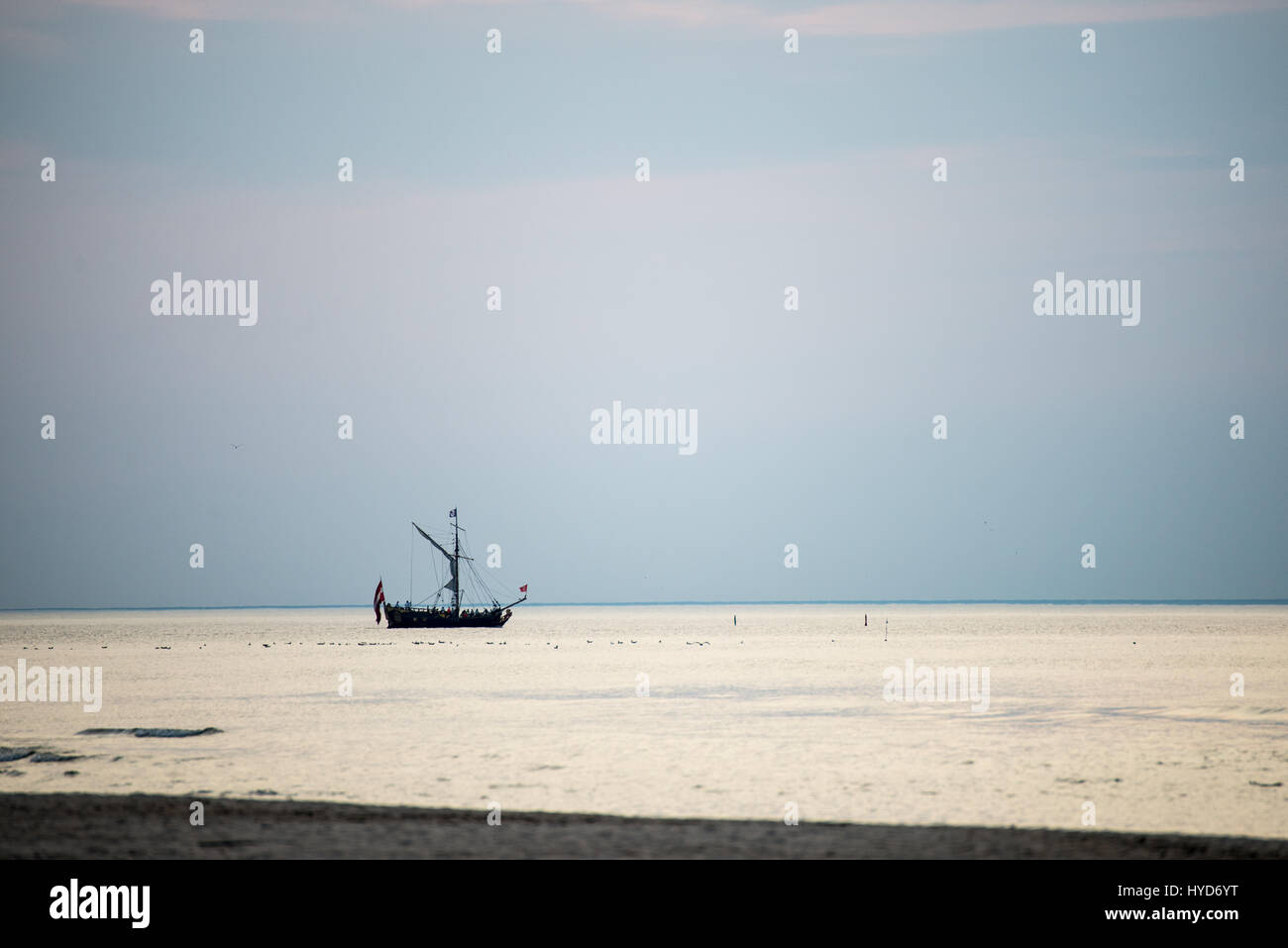 sea with waves and boats before sunset Stock Photo - Alamy
