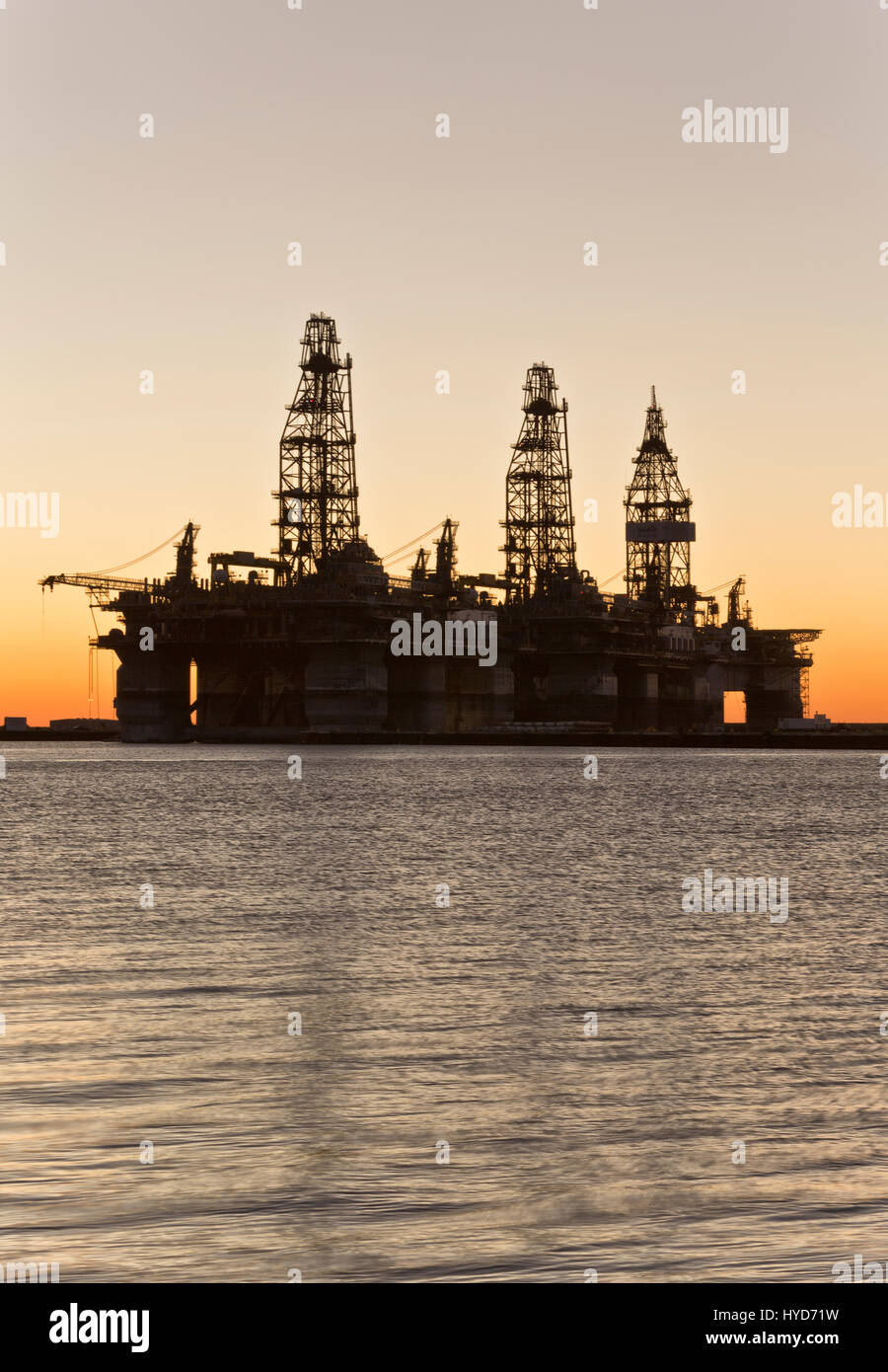 Deepwater drill rigs temporarily in storage, sunset, Harbor Island, Canyon Port, Port Aransas. Stock Photo